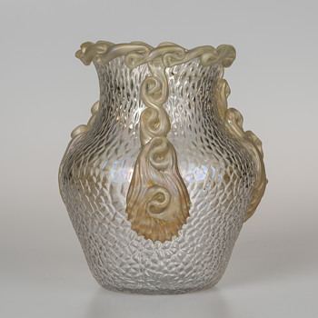 A small but interesting vase featuring a Martelé decor
