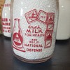 NEW ERA DAIRY WAR SLOGAN MILK BOTTLE