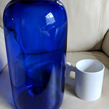 Cobalt blue over 7 liter bottle marked M in circle. What was it for? - Bottles