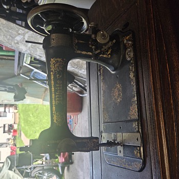 Antique white sewing machine.  - Sewing