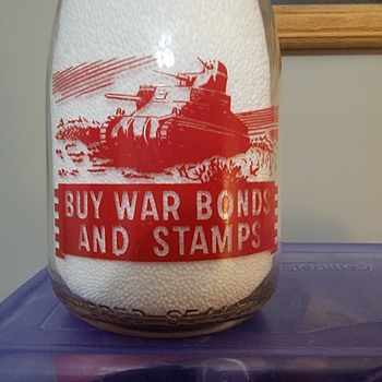 PEERLESS DAIRY...ROCK ISLAND ILLINOIS...WAR SLOGAN MILK BOTTLE WITH TANK - Bottles