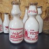 WAR SLOGAN MILK BOTTLES WITH CAPITAL DOME