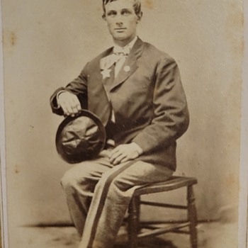 Man with star and unusual hat ny clue - Photographs
