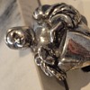 Help identifying silver human figural brooch pin and signature 