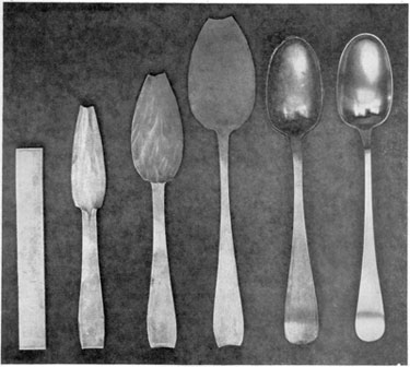 From Strip of Metal to Finished Spoon: From left to right, these six stages show the principal steps followed by Early American silversmiths in spoonmaking. It started with the strip of rolled silver at the left. Next, shaping of the bowl and handle was started and continued through three stages. Then with a punch and die the bowl was "struck up" that is, made concave and the handle was given its proper curve. After this, the edges were smoothed with files and the spoon carefully polished with burnishing tools. This set of steps follows the design of a Paul Revere spoon made about 1770.